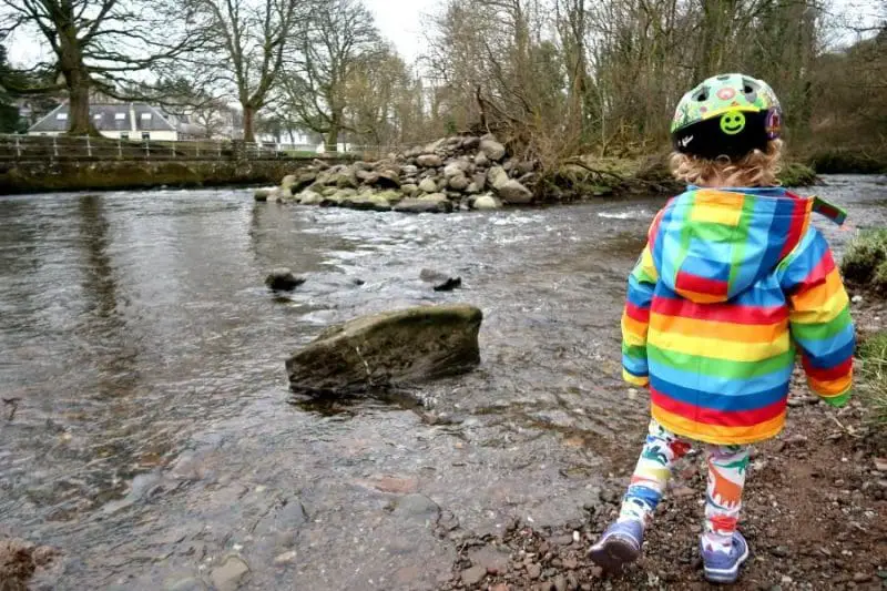 searching for stones by the river