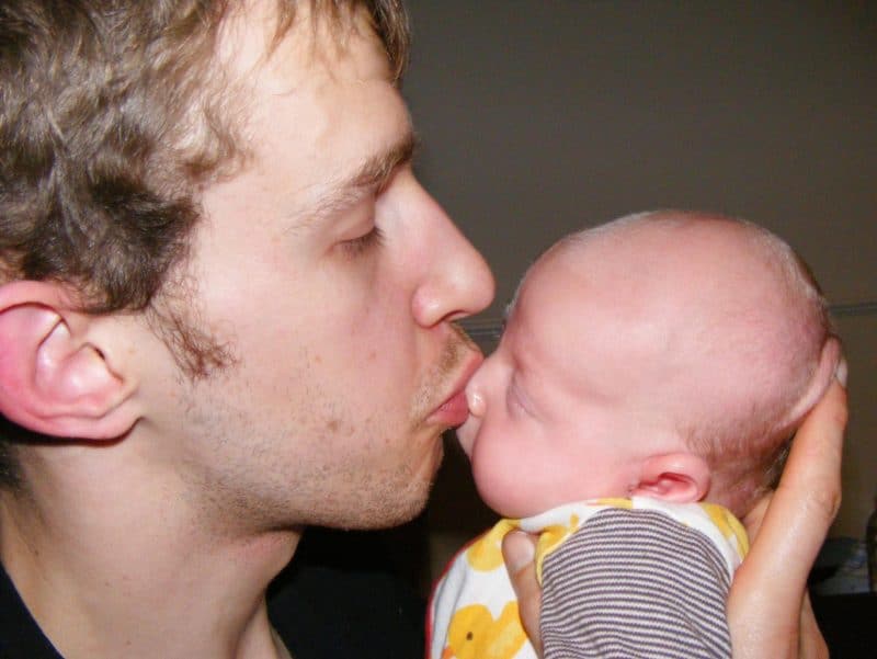 daddy kissing baby