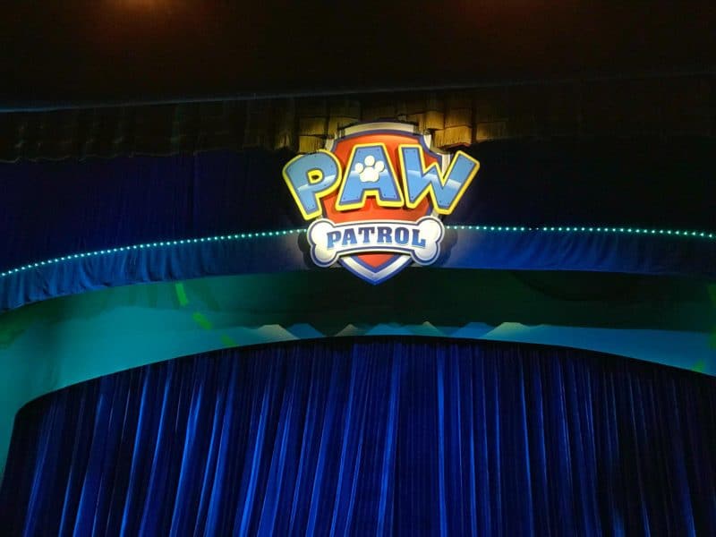 Paw Patrol badge above theatre curtain