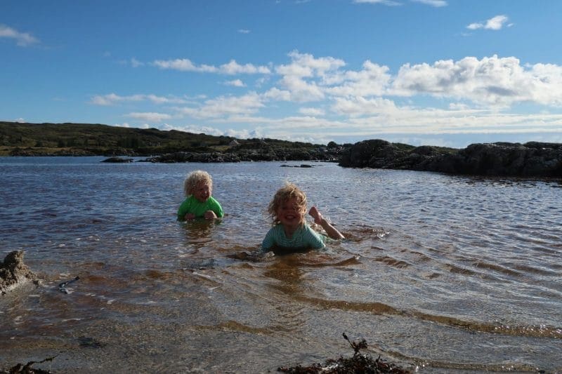 children lying in the water
