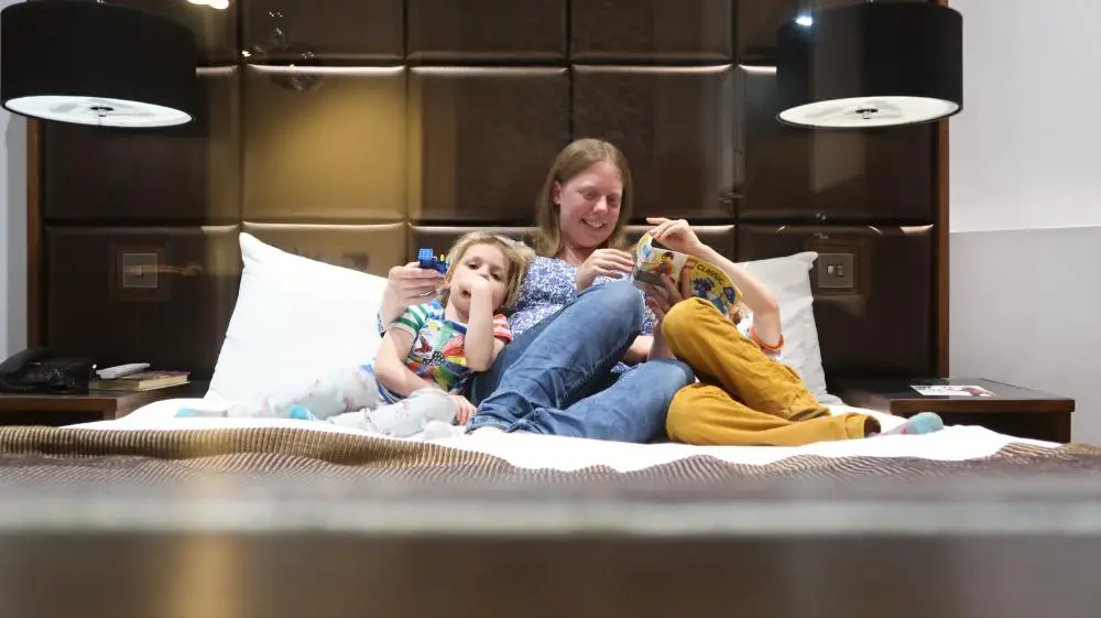 family in bed together