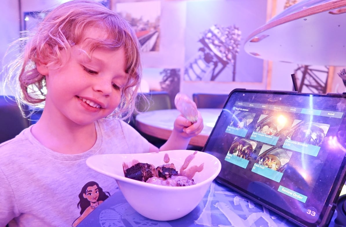 eating dessert at rollercoaster cafe