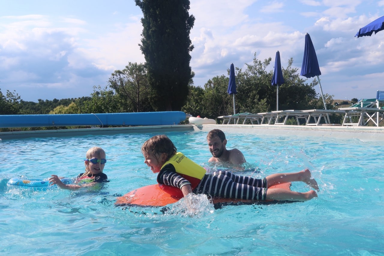 playing in pool family