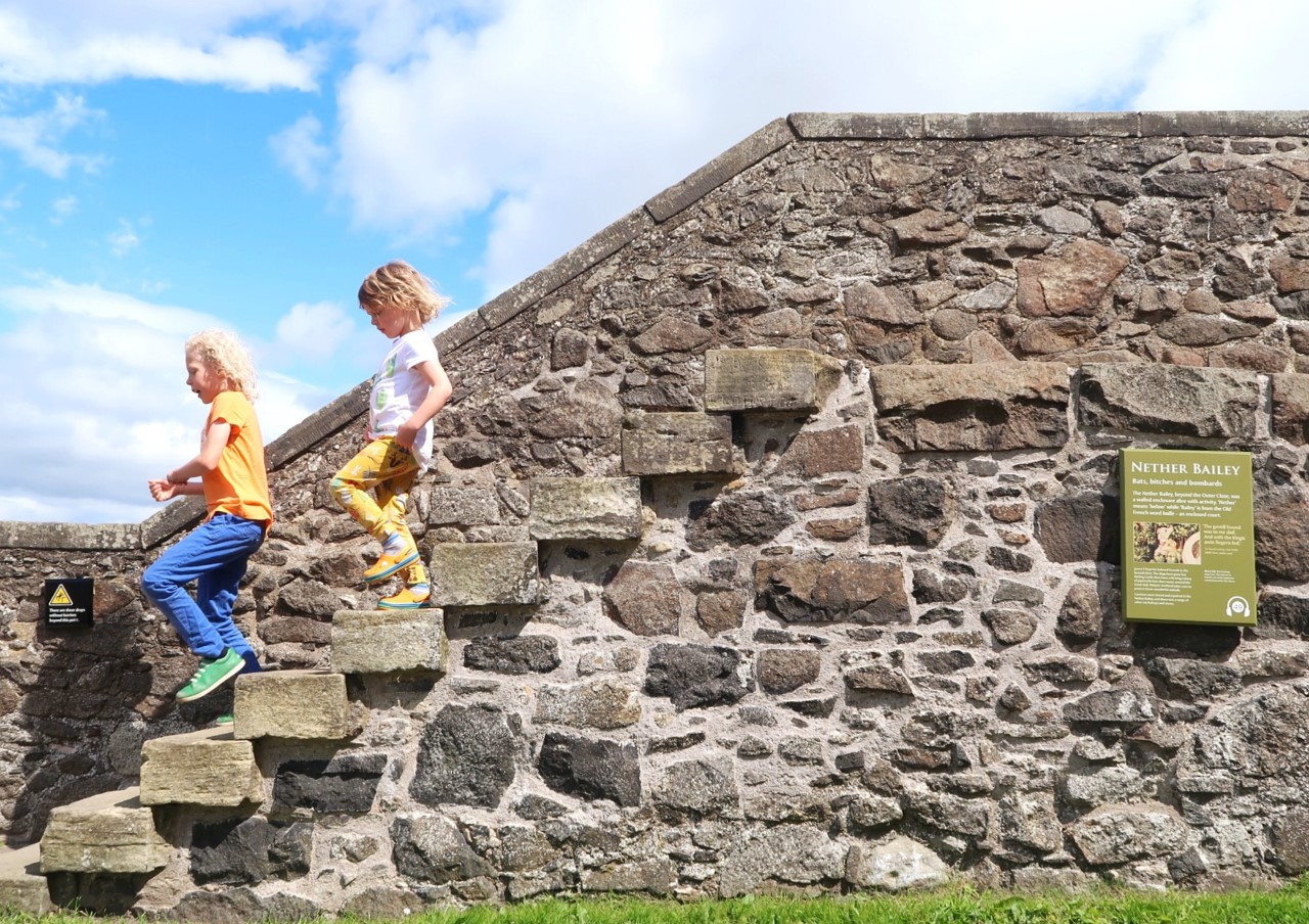 Stirling castle children running down steps