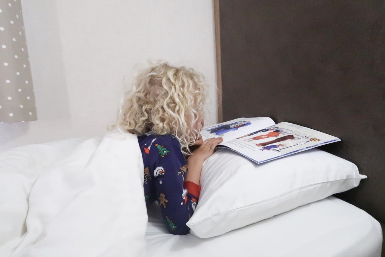 child reading in bed