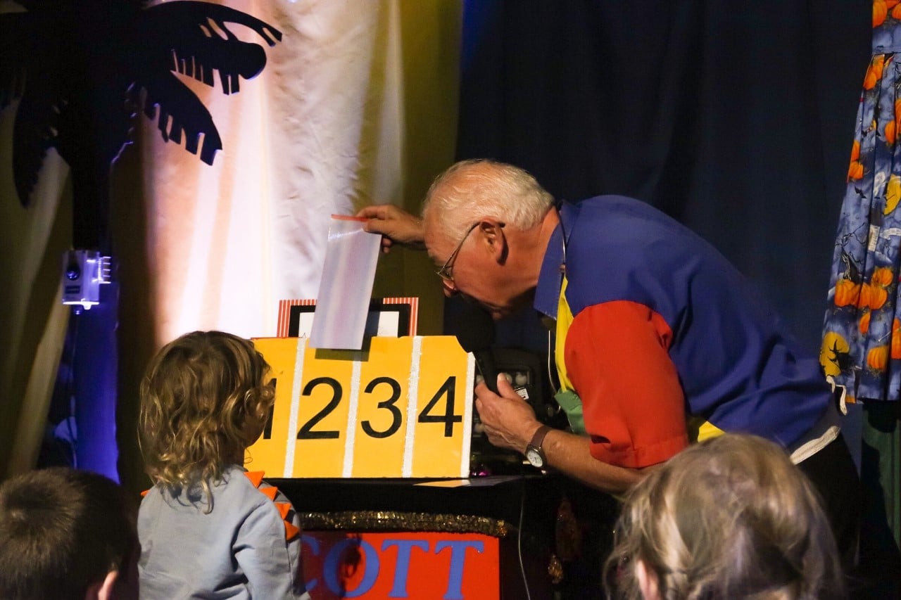 child at magic show for Halloween