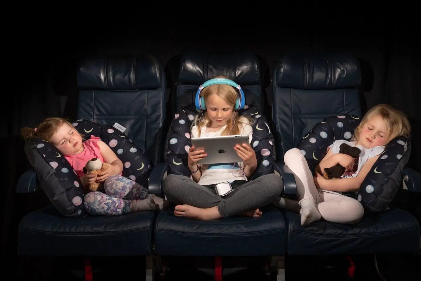 children using a cushion on airplane flight