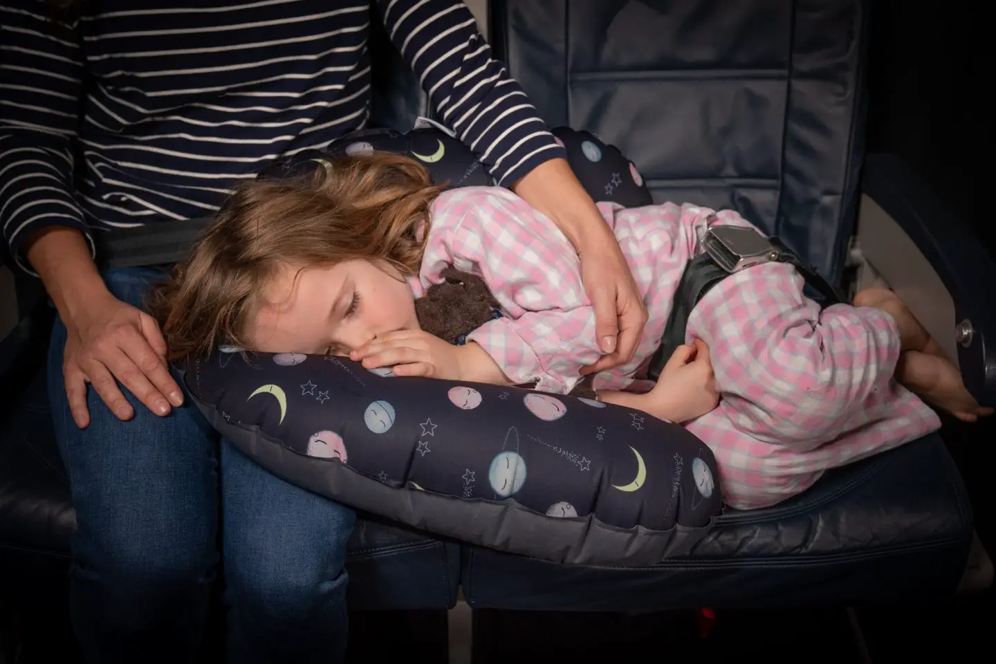 child asleep on airplane