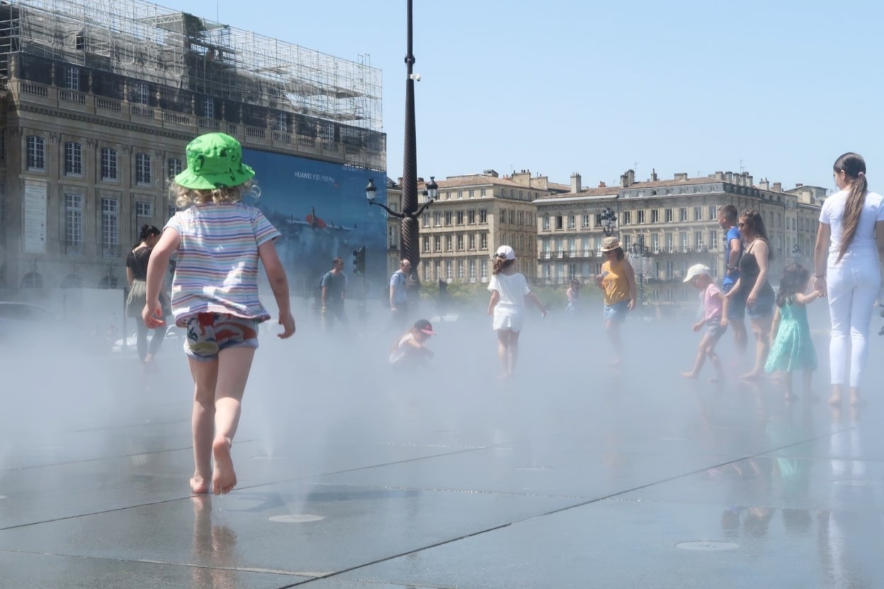 Child running through mist in Bordeaux