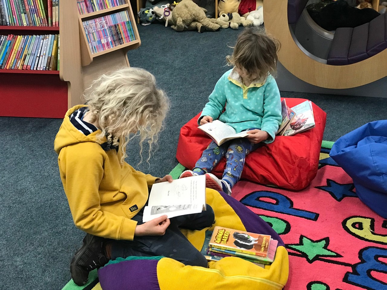 children reading at the library