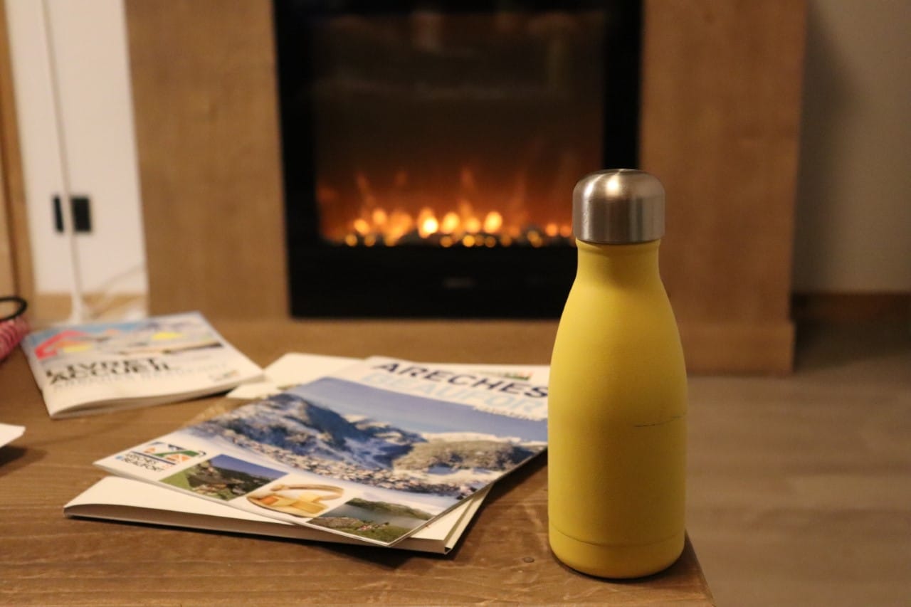 bottle and magazines at ski apartment