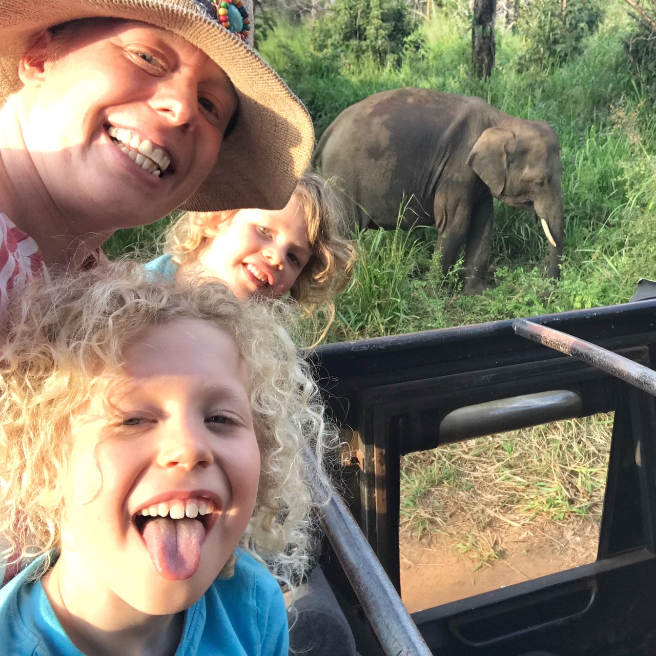 family selfie in front of wild elephant Sri Lanka