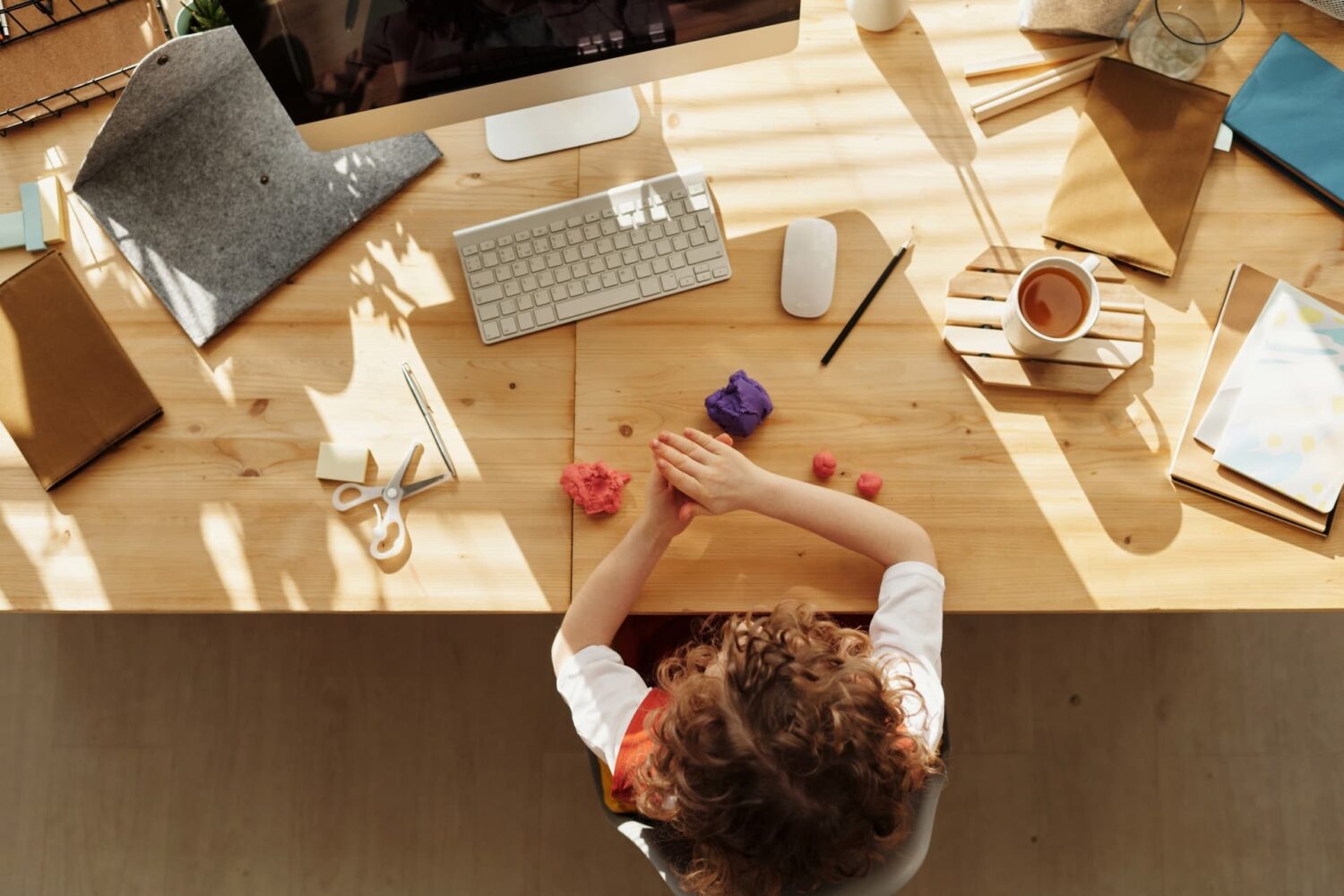 child playing whilst working