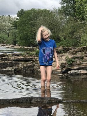 child playing in the river