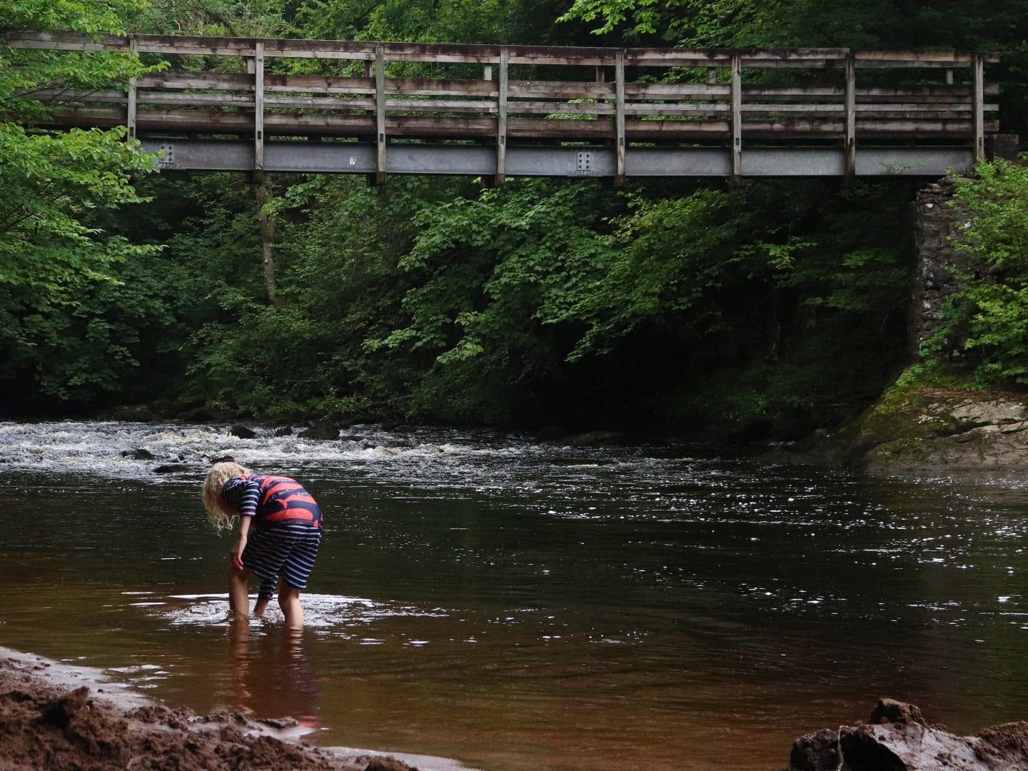 child playing in the river