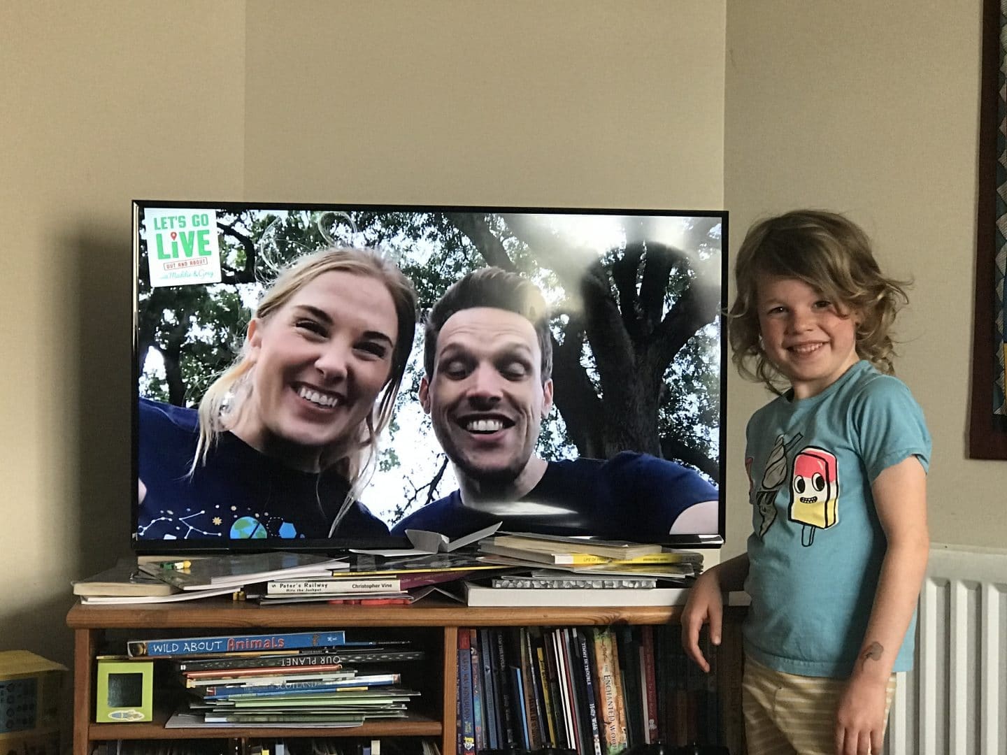 child in front of television show