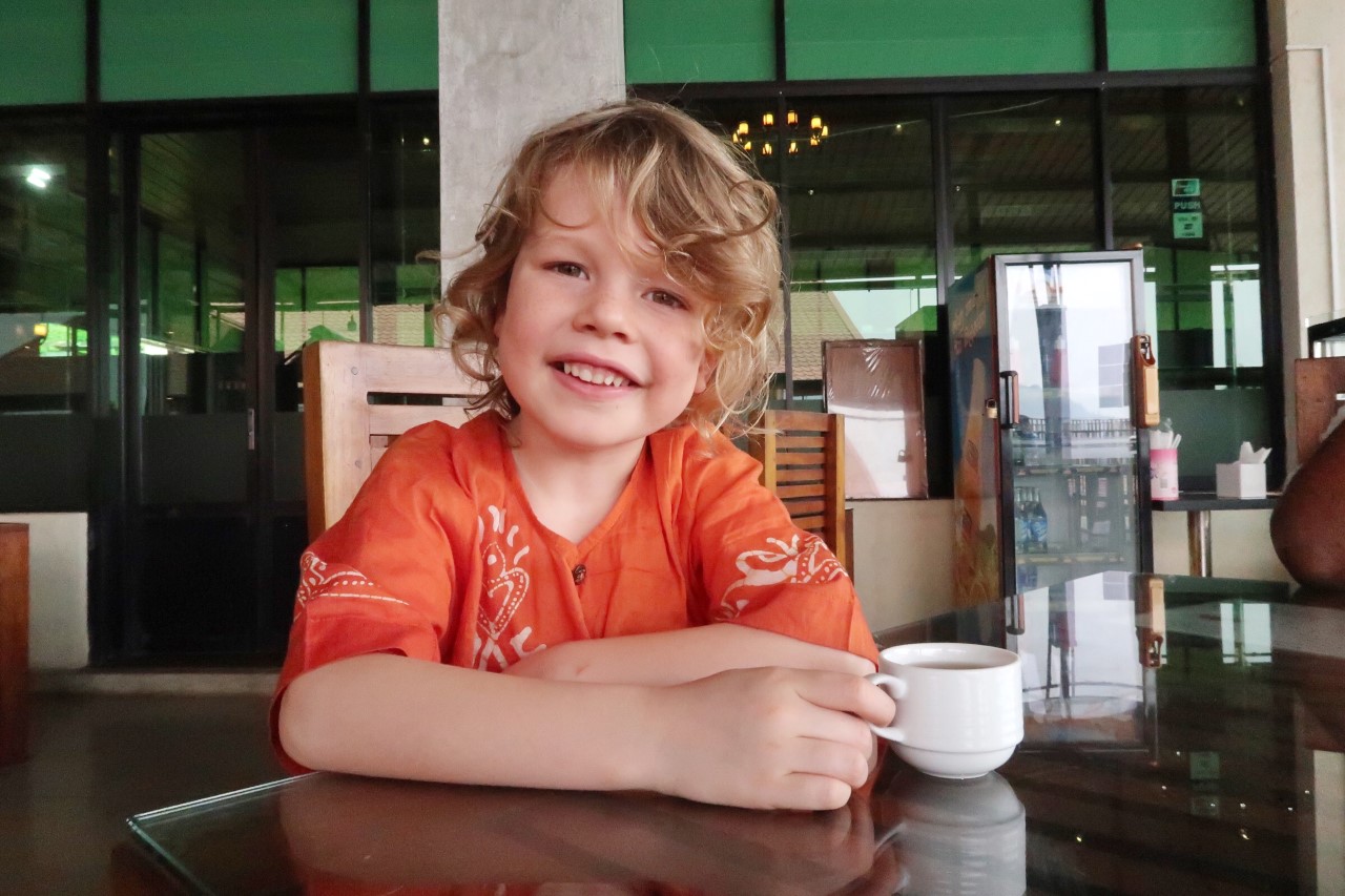 child drinking tea