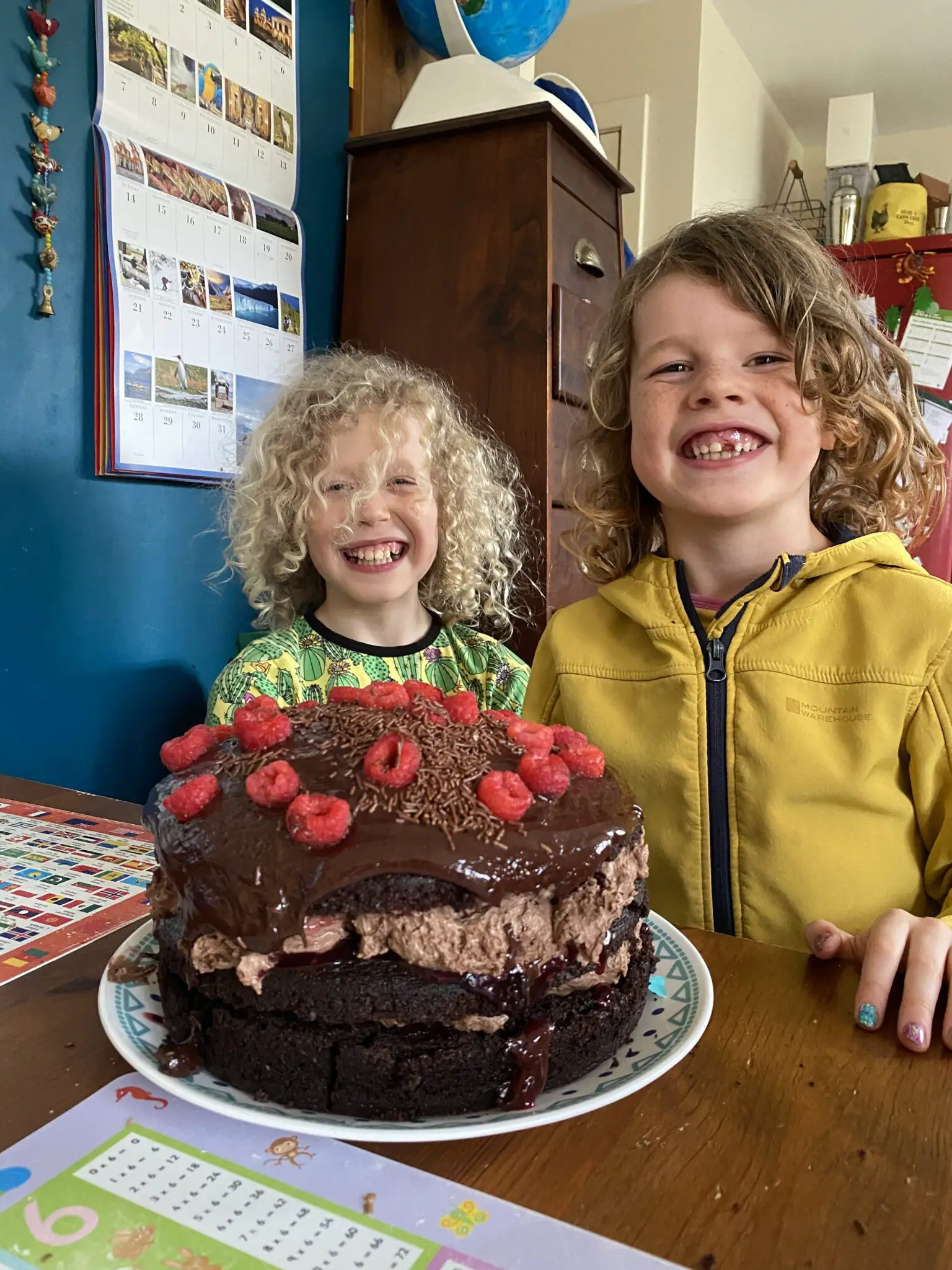 children with a giant chocolate cake