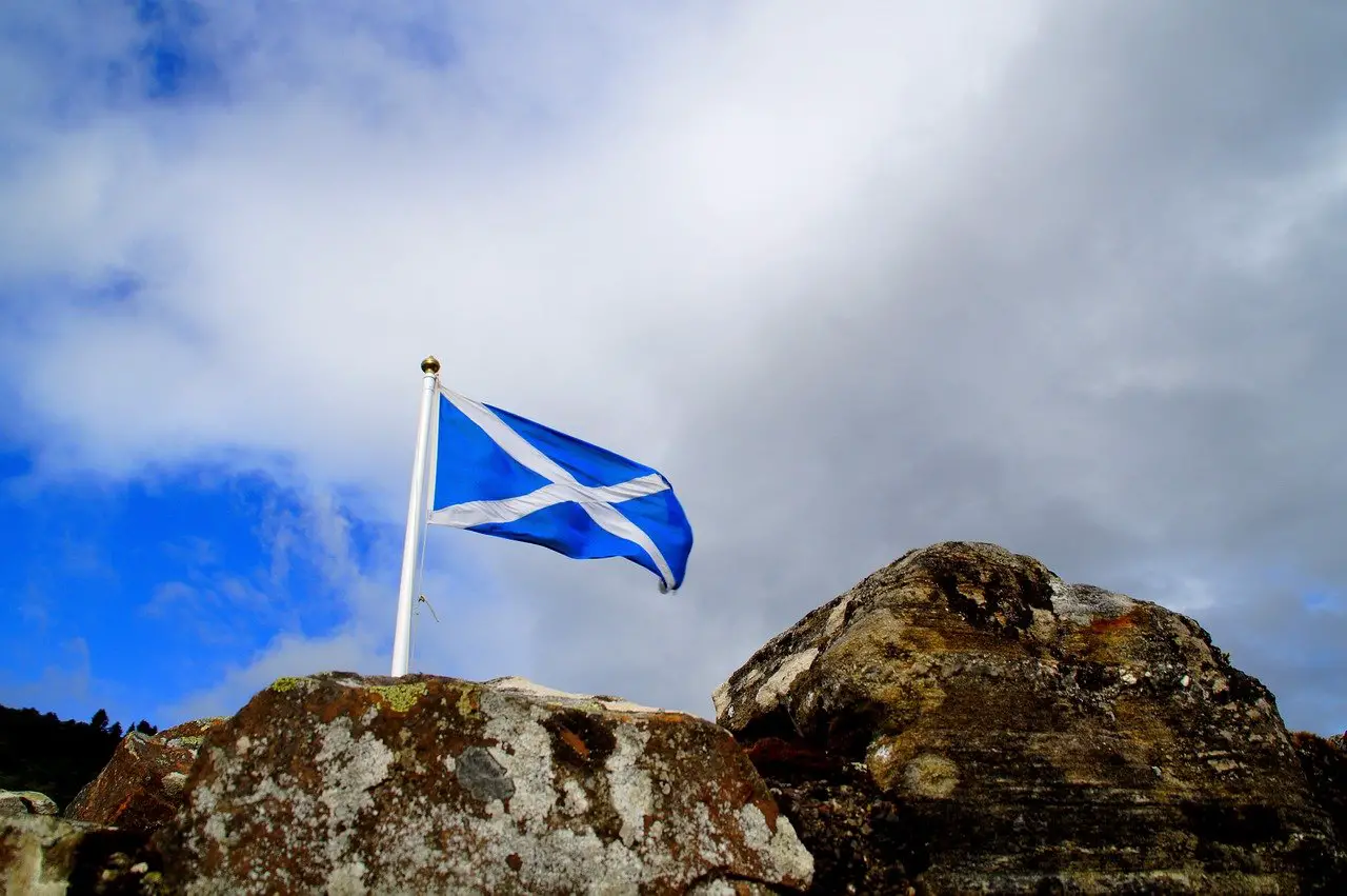 Scottish flag lying on rocks