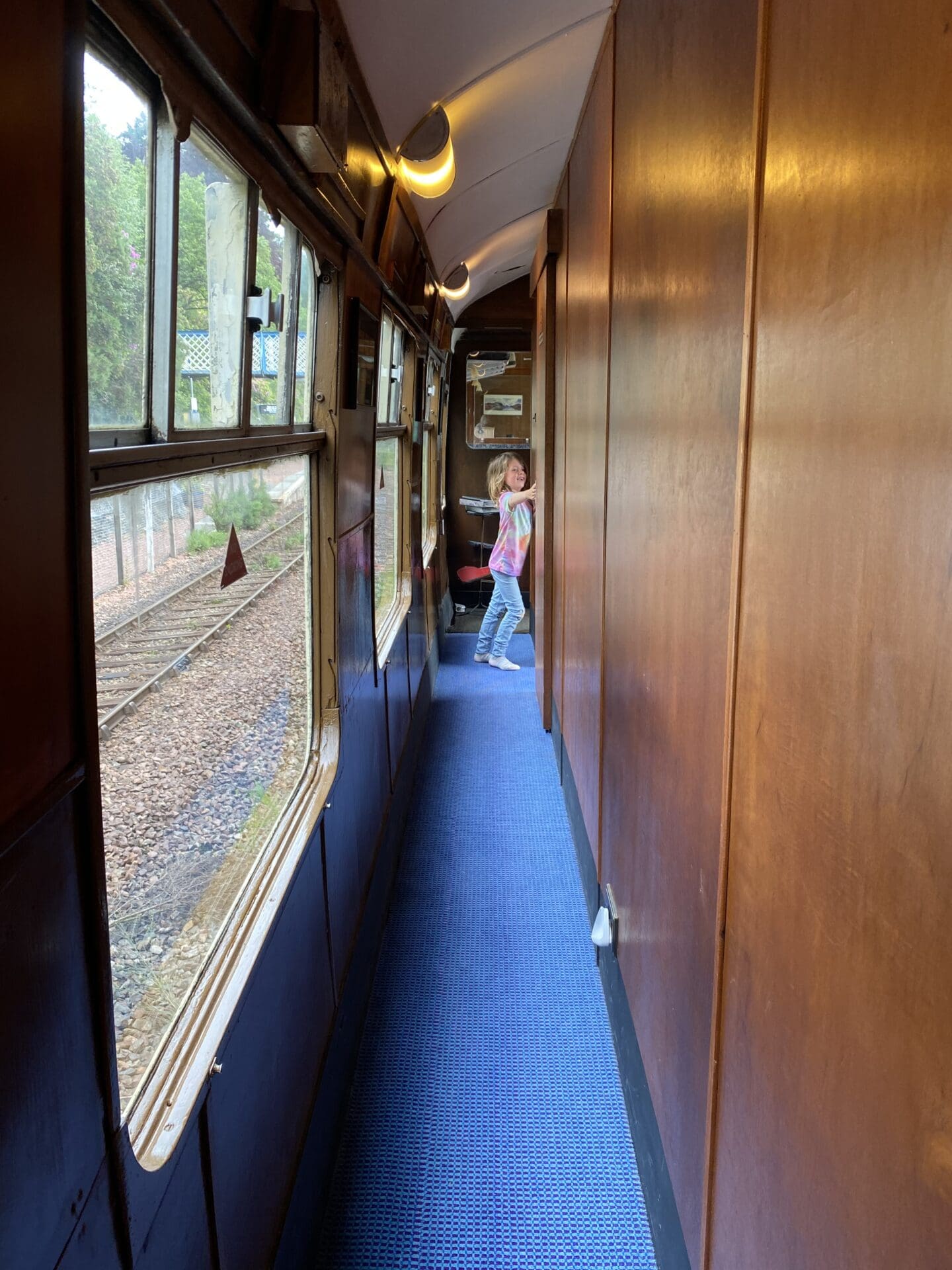 child in old railway carriage