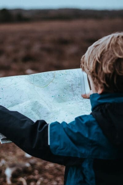 child looking at a map