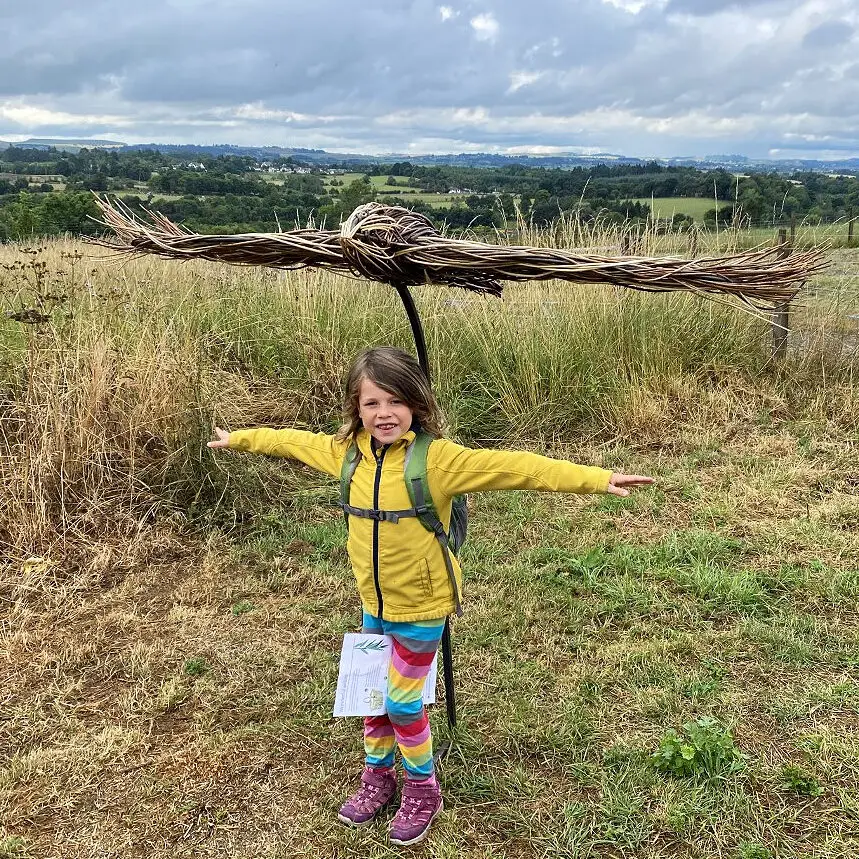 child with willow sculpture of a Buzzard