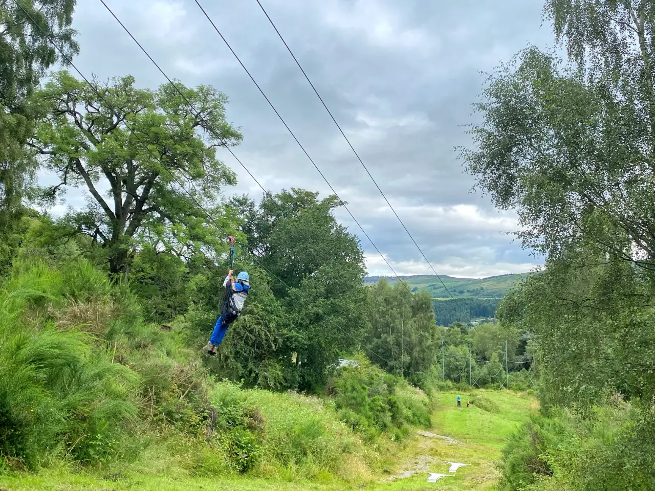 a child attached to a high zip wire at Dalguise PGL