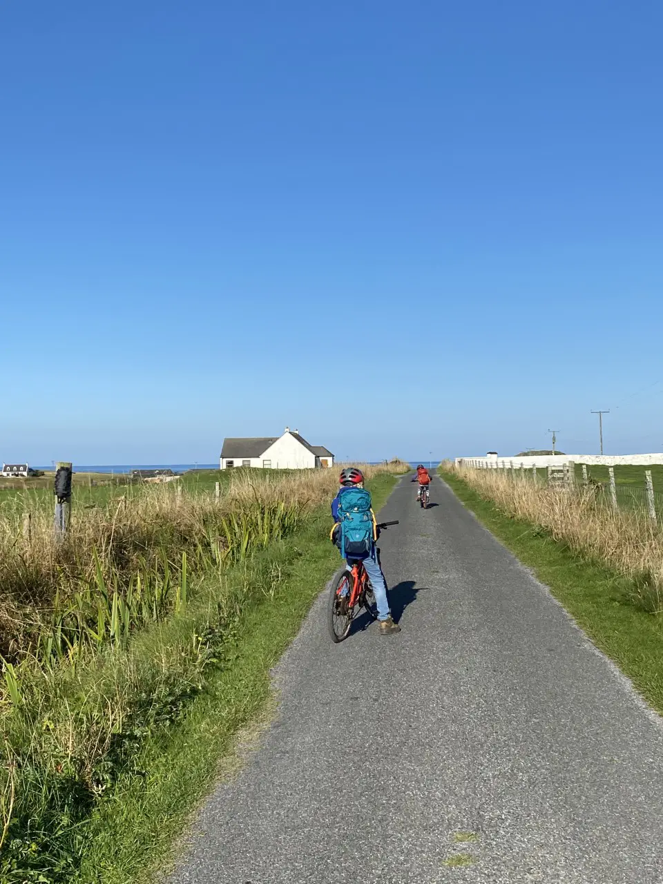 children cycling on Iona
