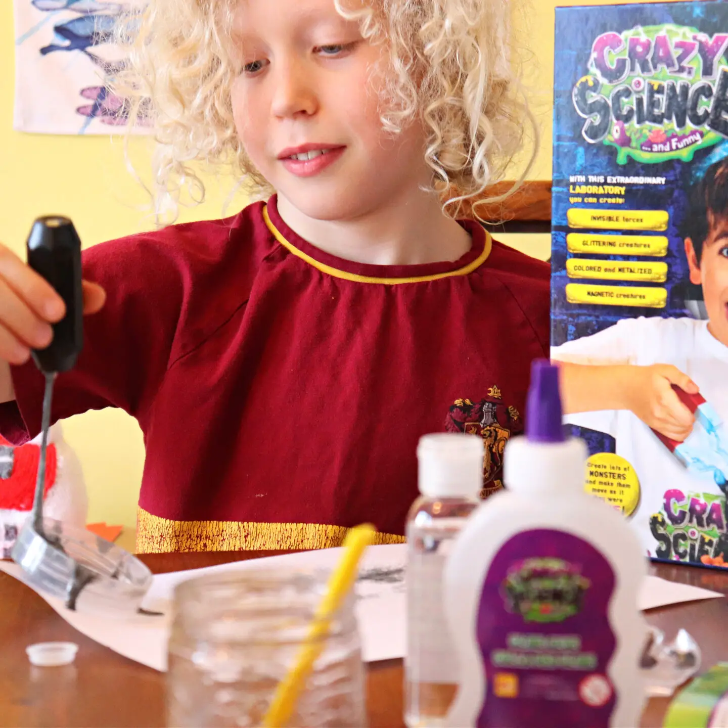 child doing a science kit