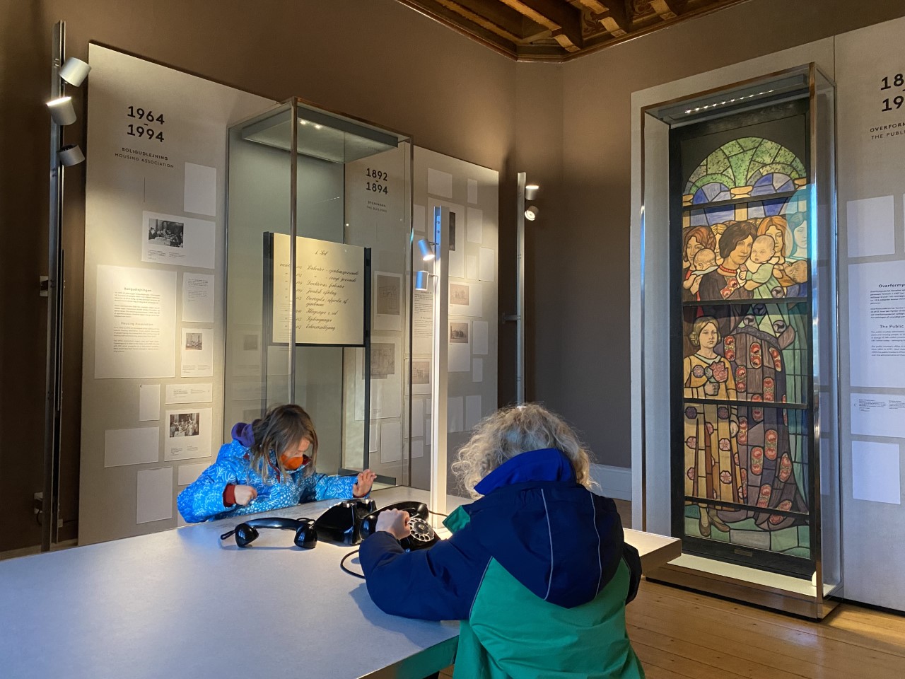 children on phones at National Museum of Copenhagen