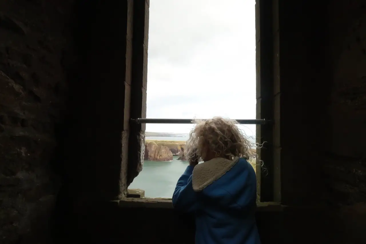 looking out the window at Dunnotar castle