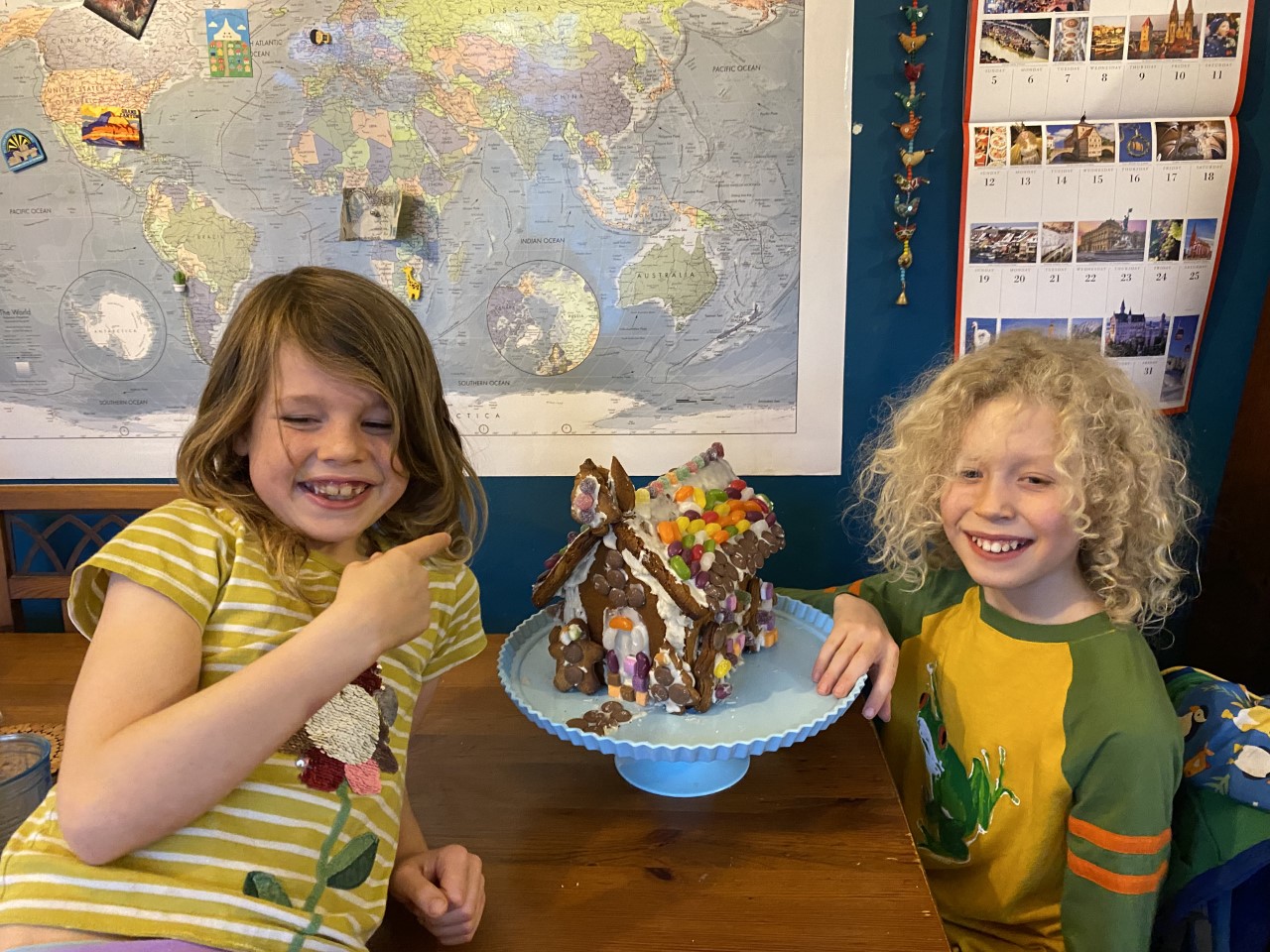 children with gingerbread house