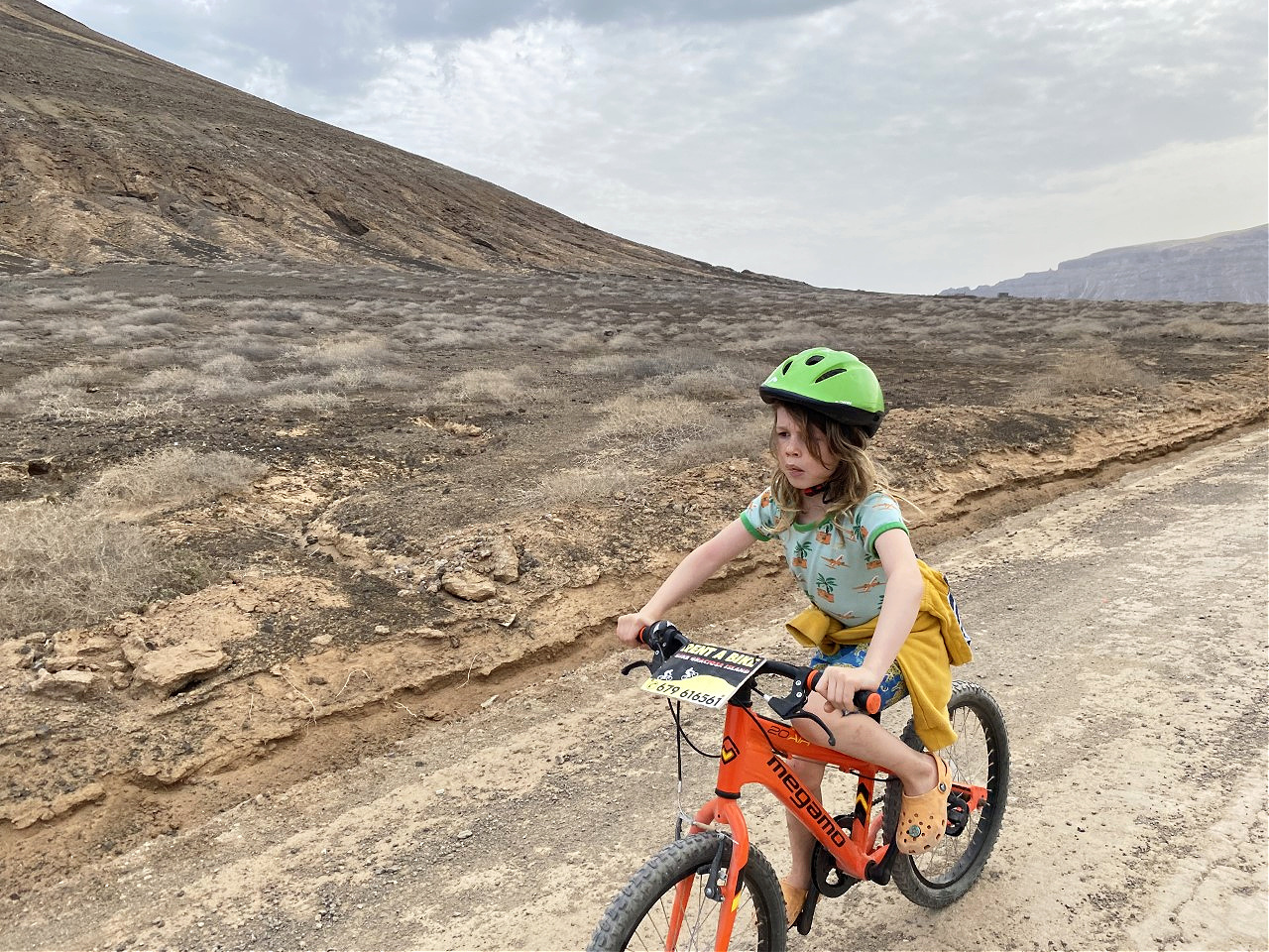 child cycling on Isla La Graciosa