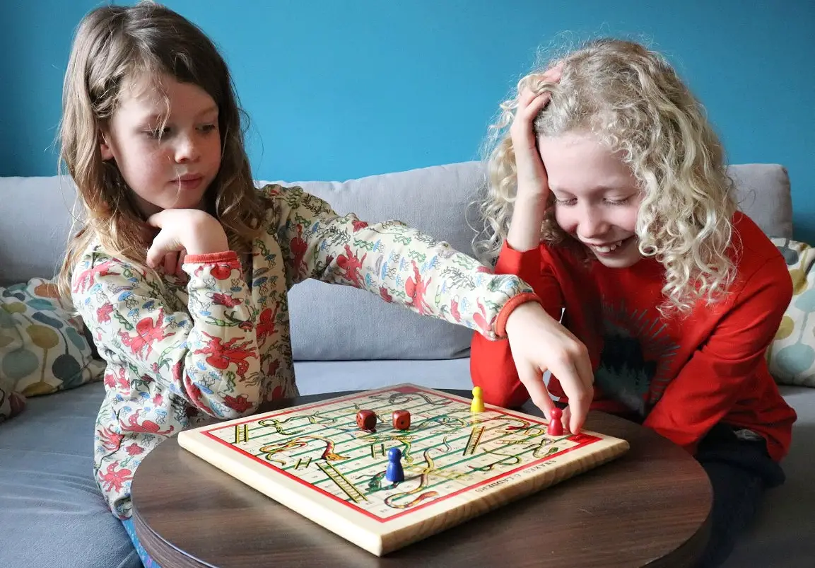 children playing snakes and ladders