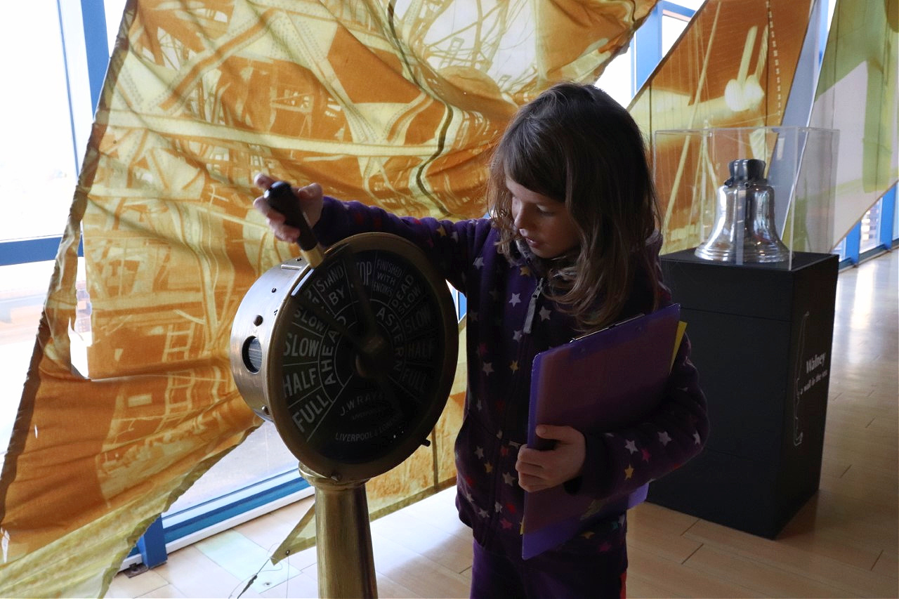 child using item at Dock Museum