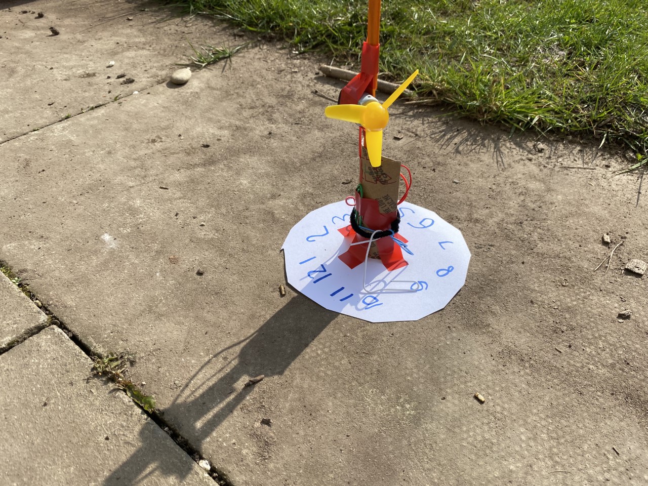 child made sundial and fan