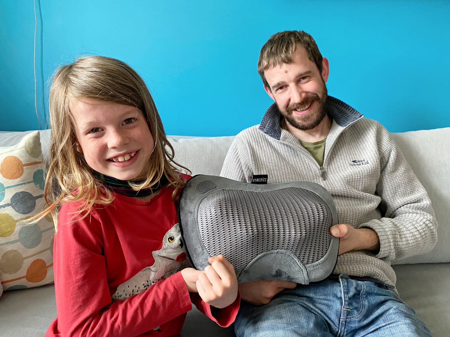 Child giving dad a pillow for Father’s Day