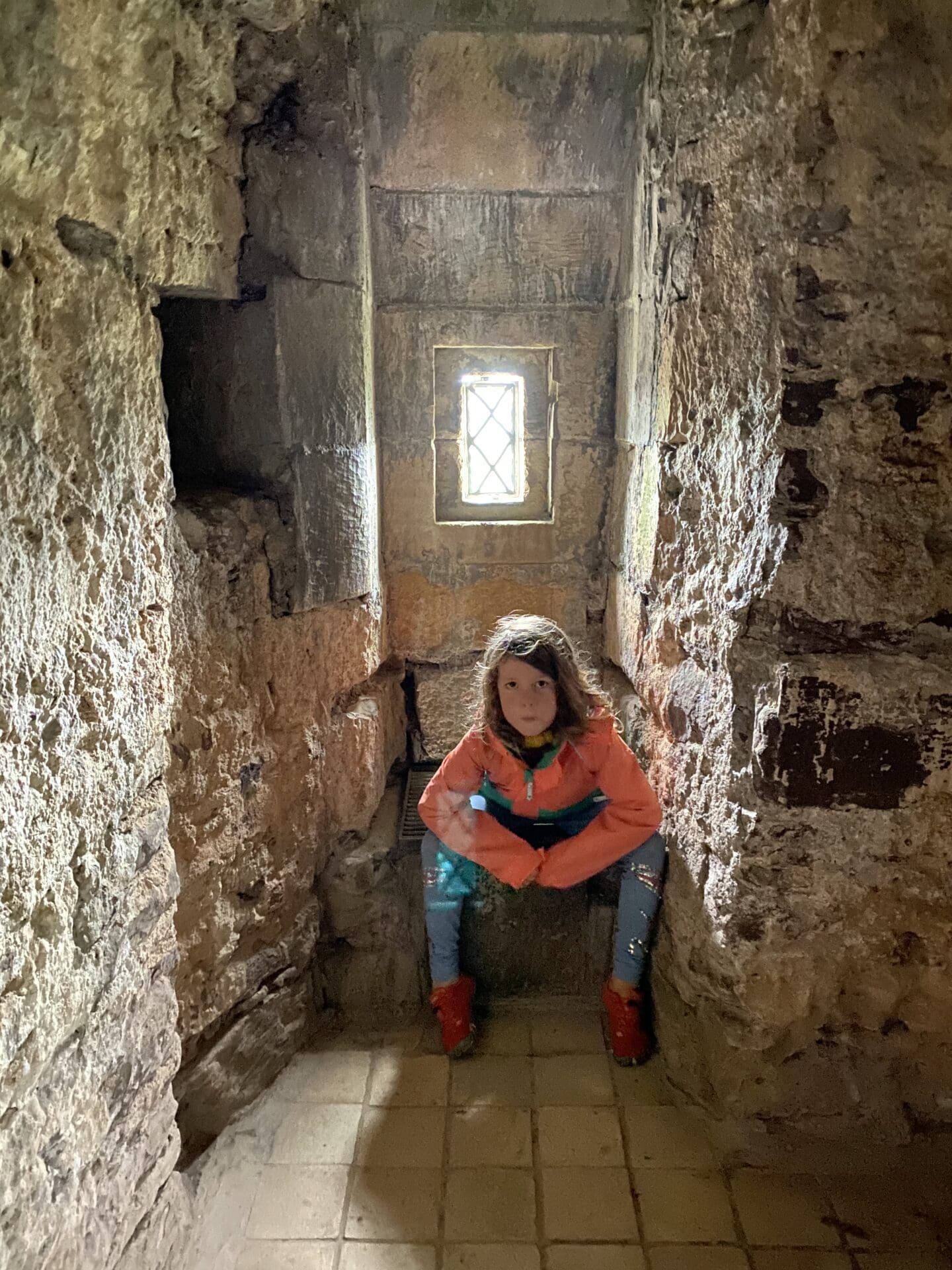 Child on toilet at Doune castle