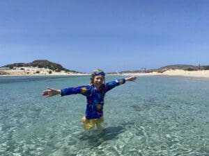 Child in sea at little Simos beach