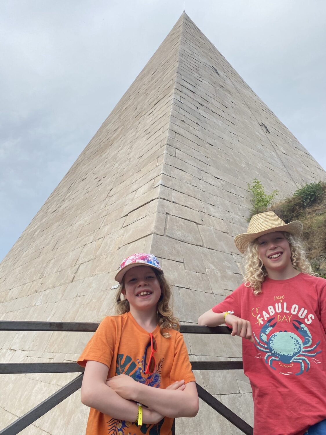 Rome pyramid, kids standing in front