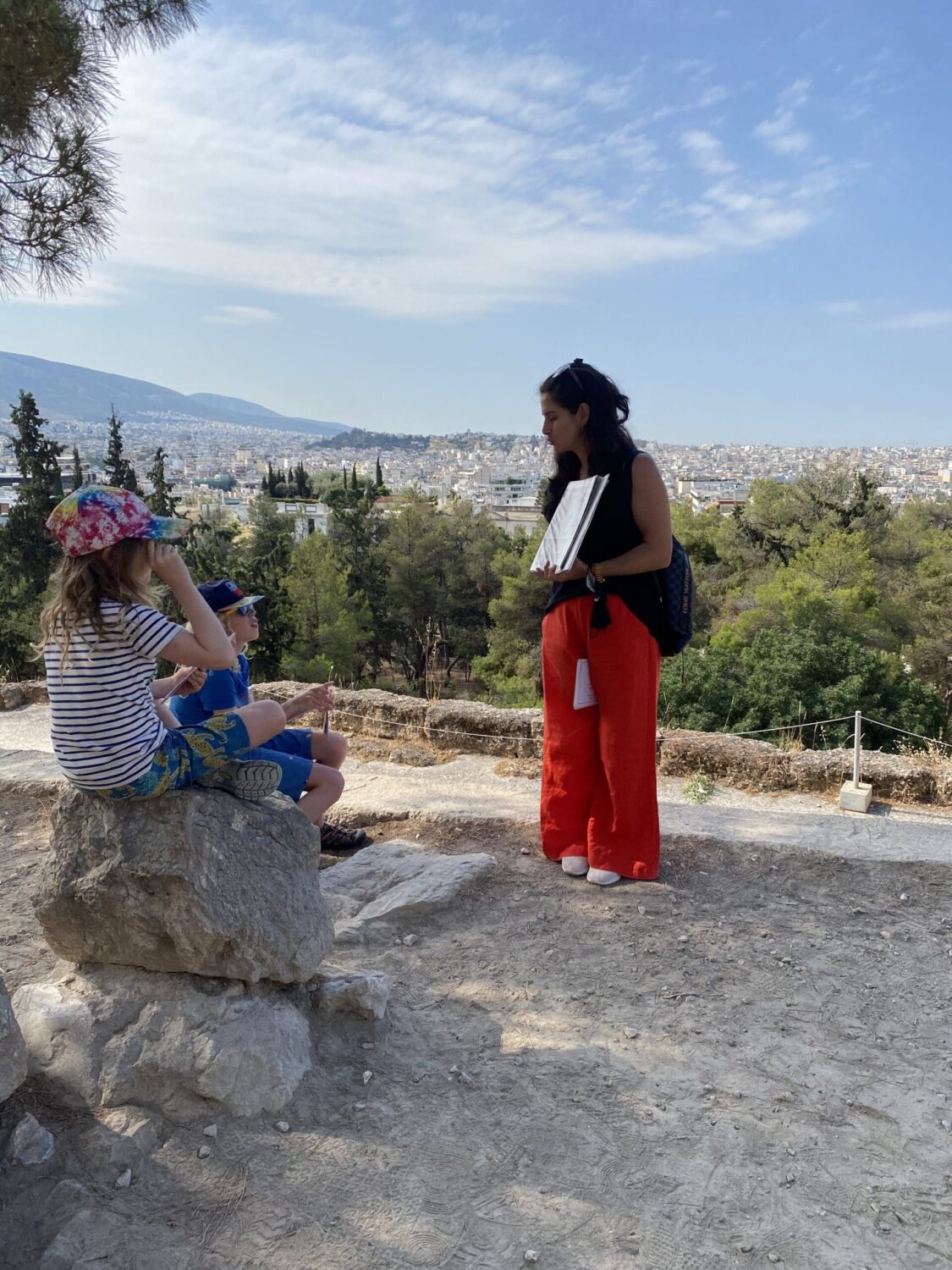 Children listening to the mythology tour on acropolis