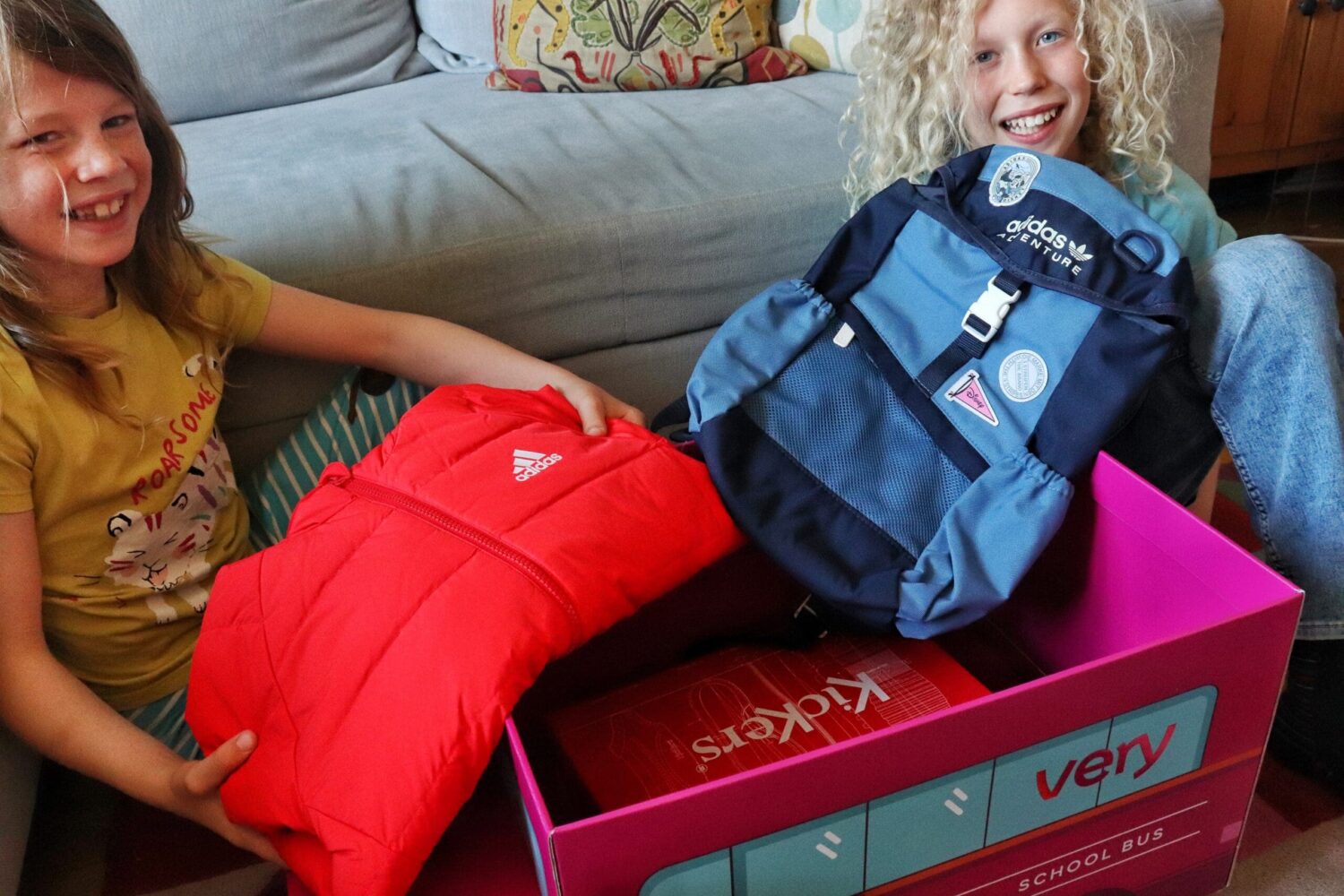 Children unboxing schoolbus