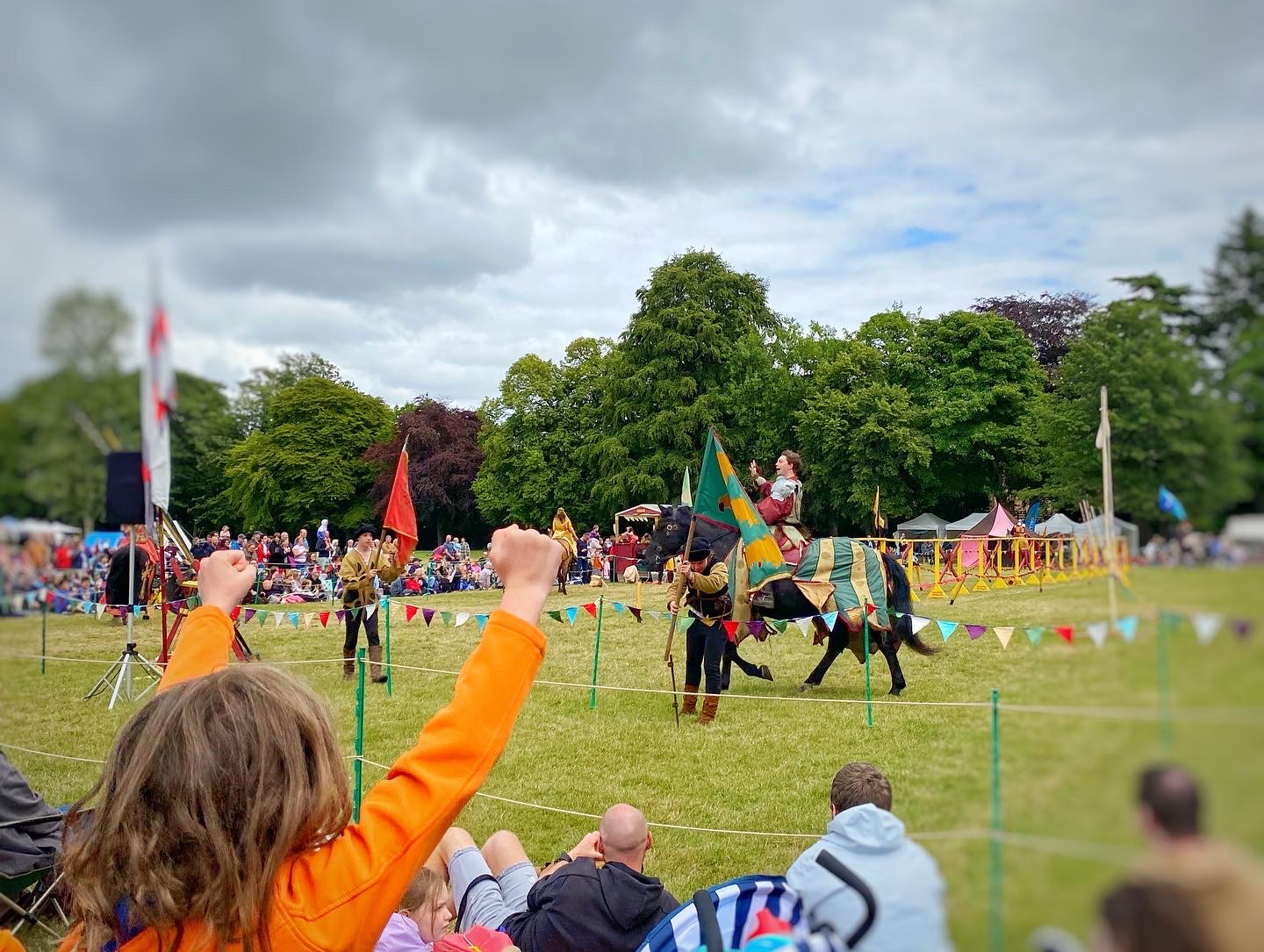 Child watching jousting on horses Linlithgow Palace