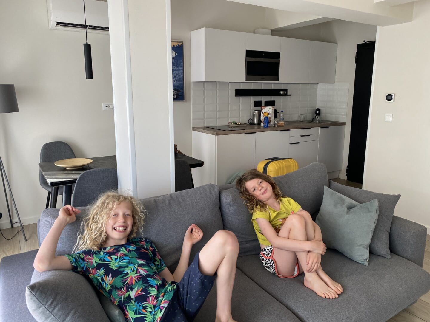 Children on sofa in aparthotel