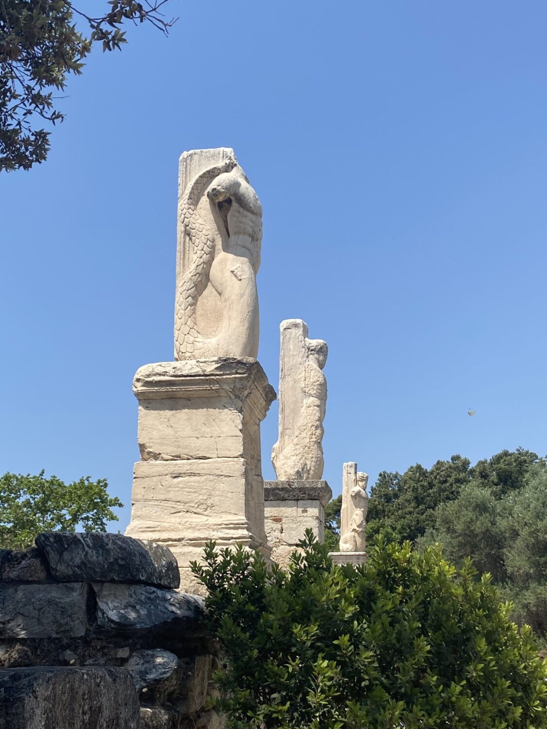 mermaid statues at ancient agora