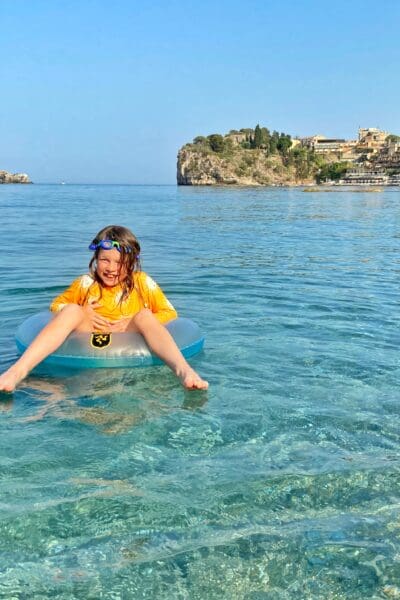 Child in sea at Taormina water mediterranean