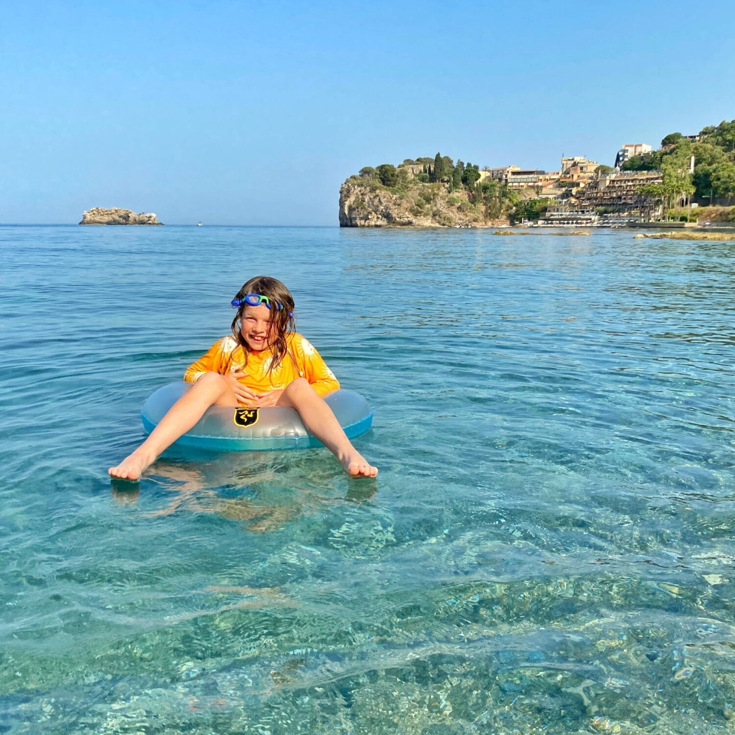 Child in sea at Taormina water mediterranean