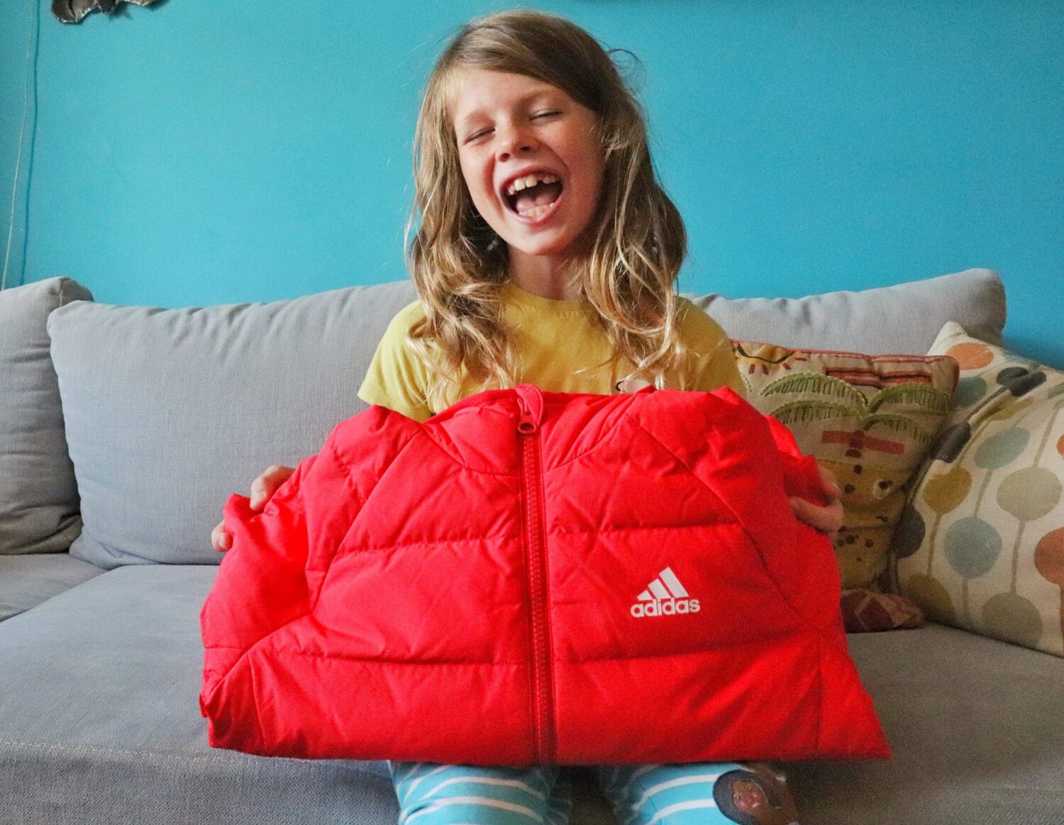 Child with orange puffer jacket