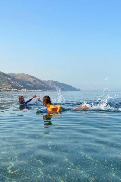 Children swimming in the sea of Sicily Mediterranean