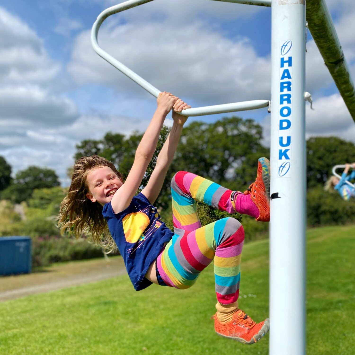 Child climbing goal post 
